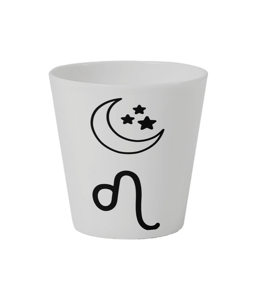 White cup with black moon and Leo star sign design on a white flowerpot. Sun-moon-rising signs & symbols have a selection of three colours- pink, yellow and black. Customers personalise Cosmic Bloom Ceramic Pot with their sun-moon-rising signs. Sun-moon-rising signs are printed around the white Cosmic Bloom Ceramic Flowerpot